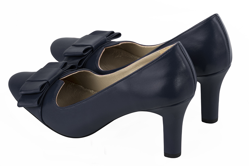 French elegance and refinement for these navy blue dress pumps, with a knot on the front, 
                available in many subtle leather and colour combinations. With its original cutout, this pretty fitted pump
will render you great services, combining comfort and distinction. 
                Matching clutches for parties, ceremonies and weddings.   
                You can customize these shoes to perfectly match your tastes or needs, and have a unique model.  
                Choice of leathers, colours, knots and heels. 
                Wide range of materials and shades carefully chosen.  
                Rich collection of flat, low, mid and high heels.  
                Small and large shoe sizes - Florence KOOIJMAN